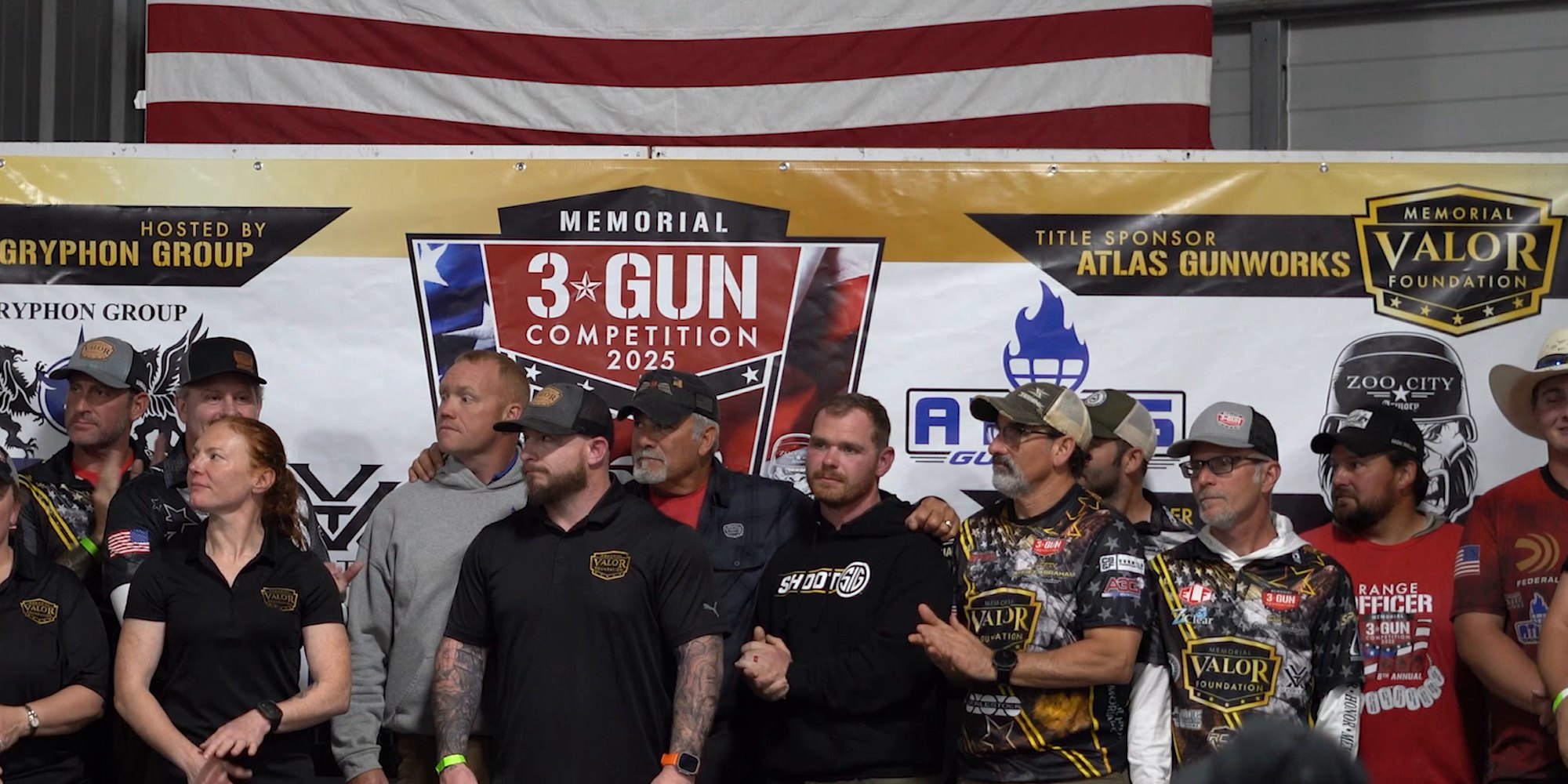 Memorial Valor Foundation staff and volunteers gather on stage during the 2025 Memorial 3 Gun ceremony