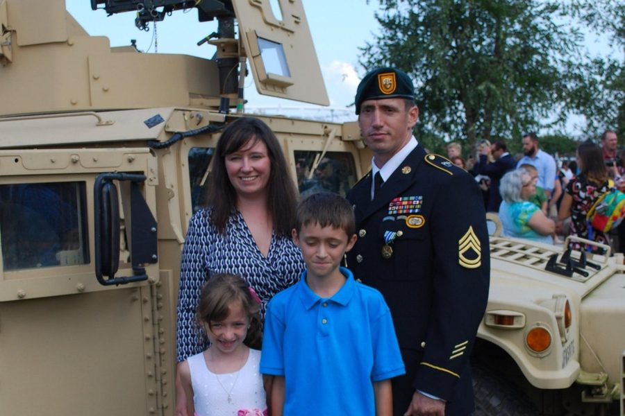 SFC Jeremy Griffin, a 2021 honoree, in uniform with his wife Amy, son Charles and daughter Makayla