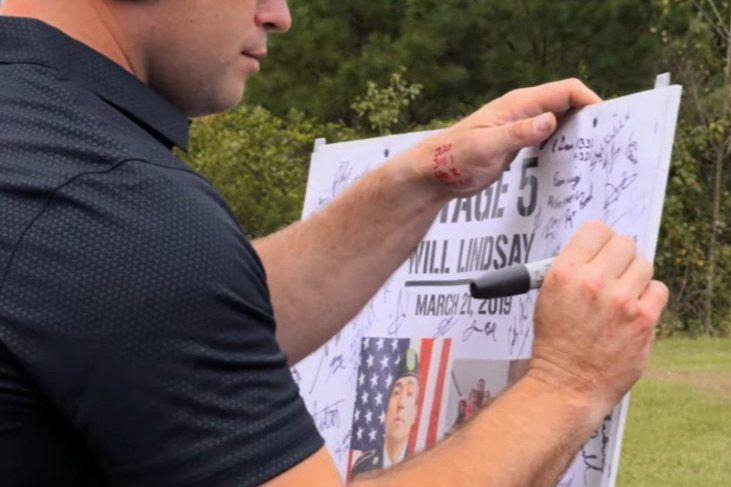 Signing the Stage 5 sign for SFC Will D. Lindsay at the 2021 Memorial 3 Gun