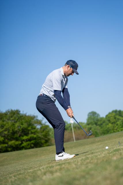 Golfer driving off the tee