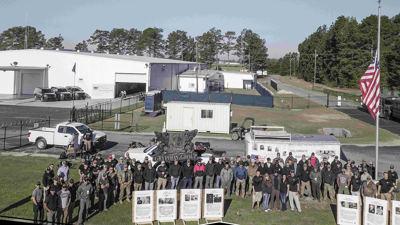 Competitors gathered for a group photo at the inaugural Memorial 3 Gun in 2018 at Gryphon Group in Maxton, North Carolina